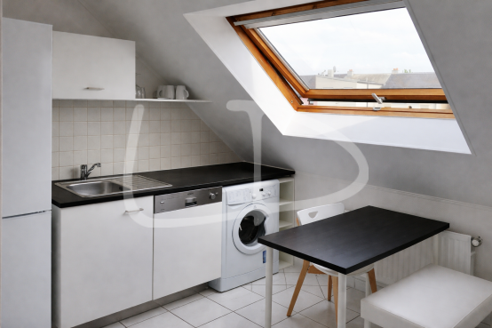 Modern attic kitchenette with skylight.png
